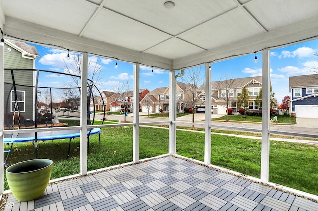 unfurnished sunroom featuring a residential view