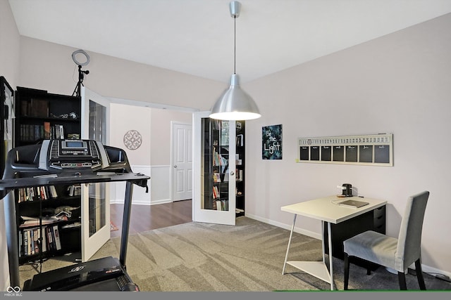 interior space with baseboards and carpet floors