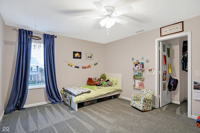 bedroom with visible vents, carpet flooring, baseboards, and ceiling fan