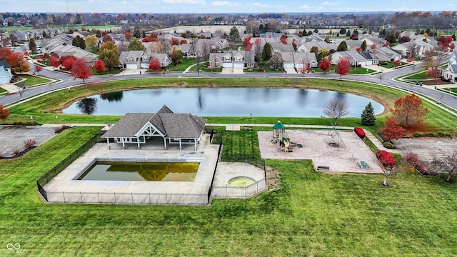 birds eye view of property featuring a residential view and a water view