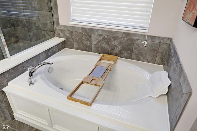 full bath with a garden tub