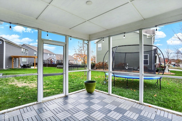 unfurnished sunroom with a residential view