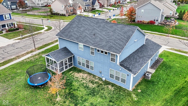 birds eye view of property with a residential view