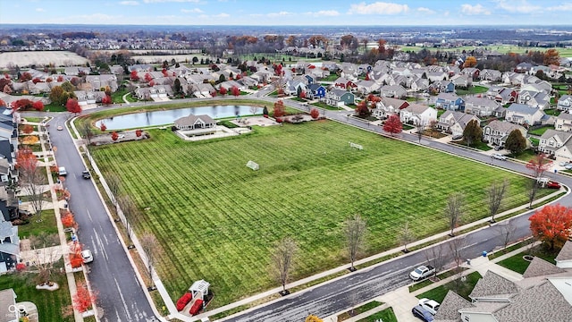 birds eye view of property with a residential view and a water view