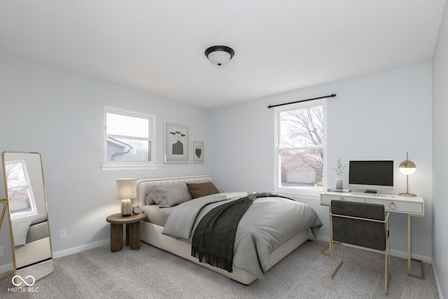 bedroom with carpet flooring and baseboards