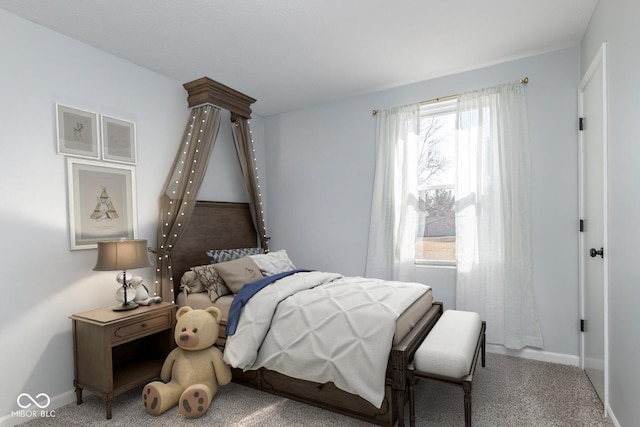 carpeted bedroom with baseboards