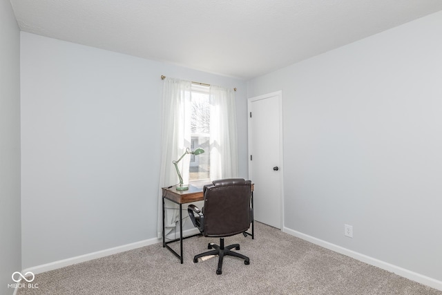 home office with carpet and baseboards