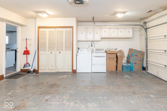 garage featuring washer and clothes dryer and a garage door opener