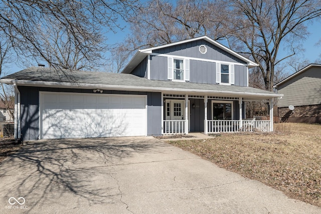 view of front of house featuring driveway, roof with shingles, a porch, a garage, and board and batten siding