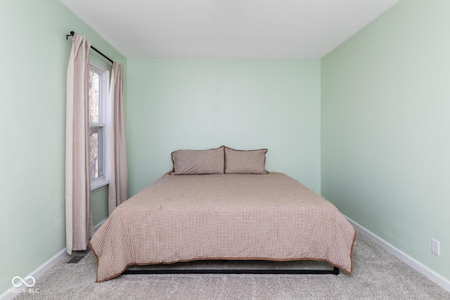 carpeted bedroom with baseboards