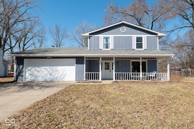 traditional home with covered porch, board and batten siding, an attached garage, and concrete driveway