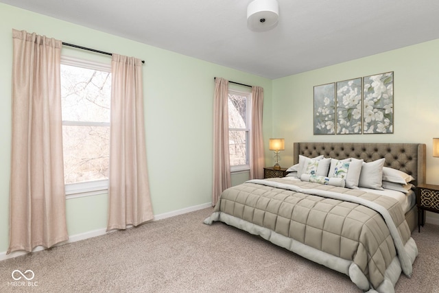 bedroom featuring baseboards and carpet floors