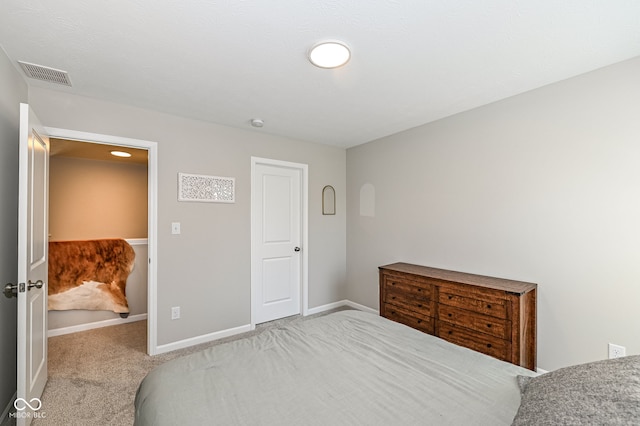 carpeted bedroom with baseboards and visible vents