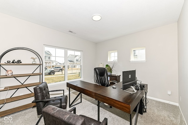 home office with carpet flooring, baseboards, and visible vents