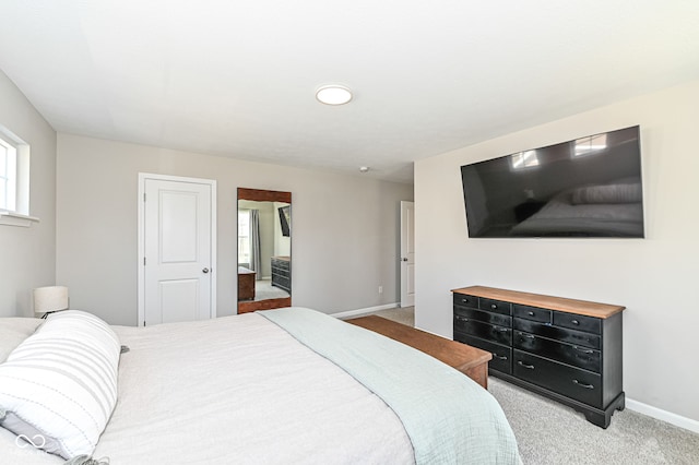 bedroom featuring carpet flooring and baseboards