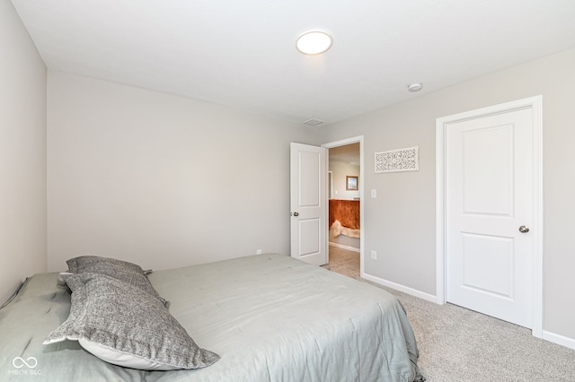 bedroom featuring baseboards and light colored carpet