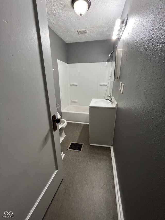 full bath with visible vents, shower / bath combination, a textured wall, a textured ceiling, and vanity