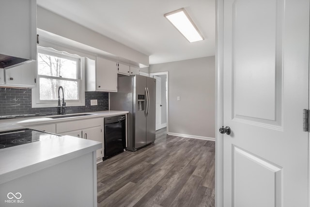 kitchen with a sink, backsplash, dark wood-style floors, stainless steel fridge with ice dispenser, and dishwasher