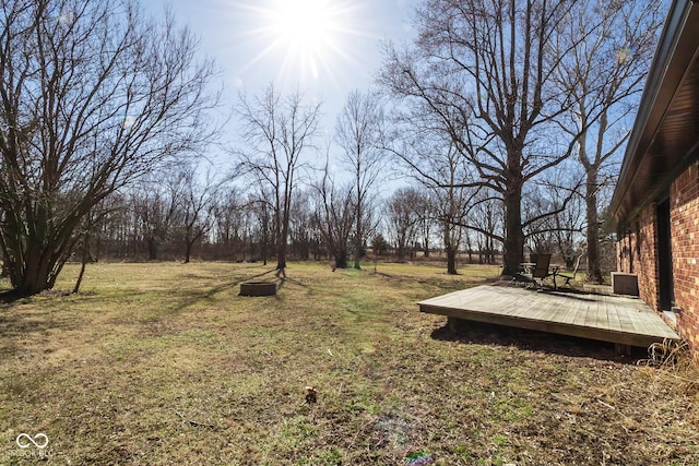 view of yard featuring a wooden deck