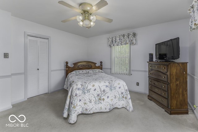 6204 S Madison Ave, Indianapolis, IN 46227 - bedroom with light colored carpet, a closet, and a ceiling fan