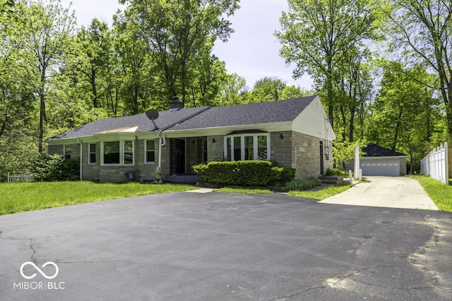 6204 S Madison Ave, Indianapolis, IN 46227 - ranch-style house featuring stone siding, an outbuilding, a chimney, and a garage