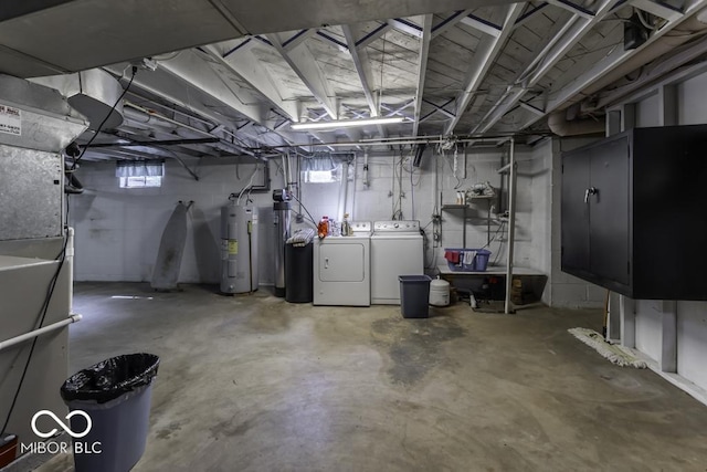 6204 S Madison Ave, Indianapolis, IN 46227 - below grade area featuring electric water heater and independent washer and dryer