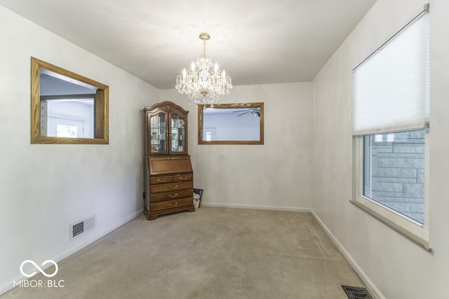 6204 S Madison Ave, Indianapolis, IN 46227 - unfurnished room with a chandelier and light colored carpet