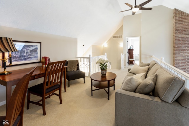 living area featuring vaulted ceiling, light colored carpet, visible vents, and ceiling fan