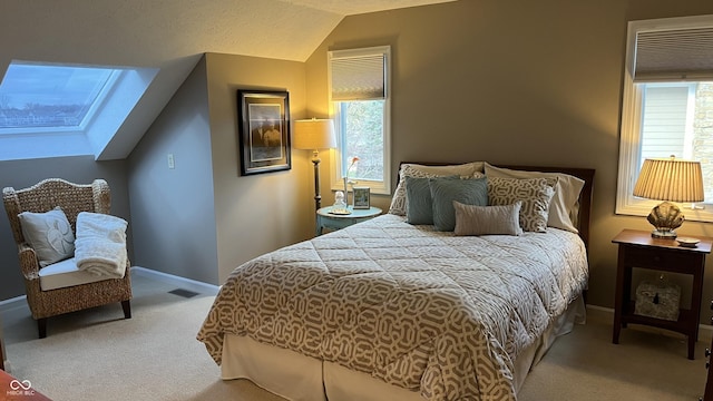 bedroom with carpet flooring, multiple windows, lofted ceiling, and visible vents