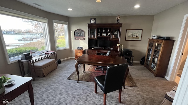 carpeted home office with recessed lighting, baseboards, visible vents, and a textured ceiling