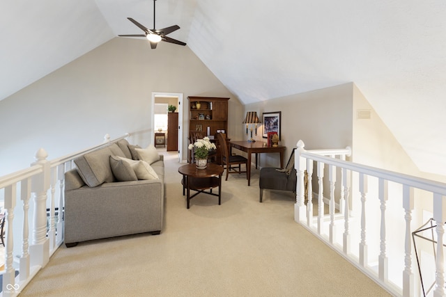 carpeted living room with a ceiling fan and high vaulted ceiling