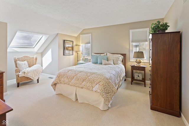 bedroom featuring light carpet, baseboards, and vaulted ceiling