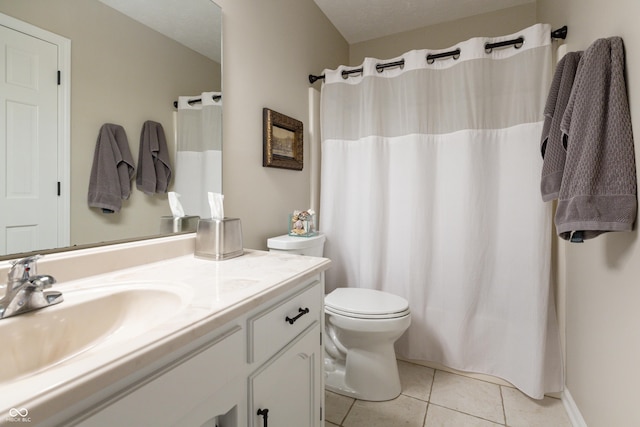 bathroom with a shower with curtain, toilet, vanity, and tile patterned flooring