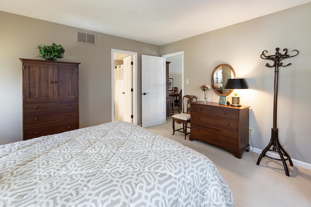 bedroom with visible vents, light colored carpet, and baseboards