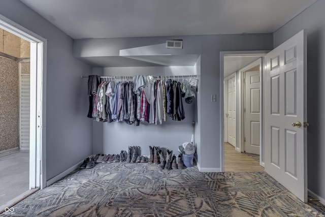 unfurnished bedroom featuring visible vents and baseboards