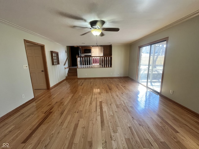 unfurnished living room with light wood finished floors, baseboards, ceiling fan, and ornamental molding