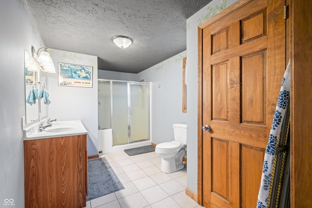 bathroom with vanity, a stall shower, tile patterned flooring, a textured ceiling, and toilet