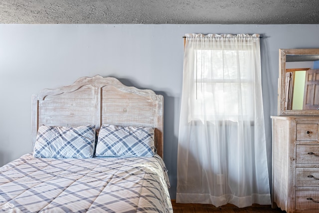 bedroom featuring a textured ceiling