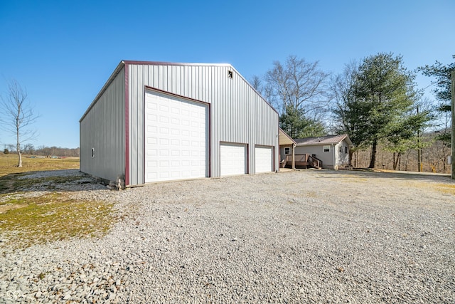 detached garage featuring driveway