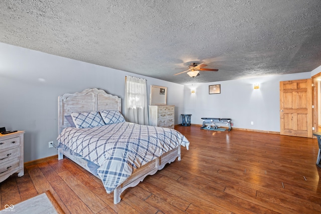 bedroom featuring hardwood / wood-style floors, ceiling fan, baseboards, and a textured ceiling