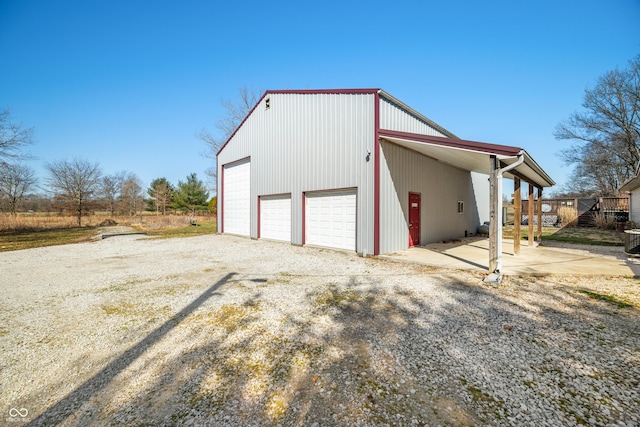 exterior space featuring an outdoor structure and driveway