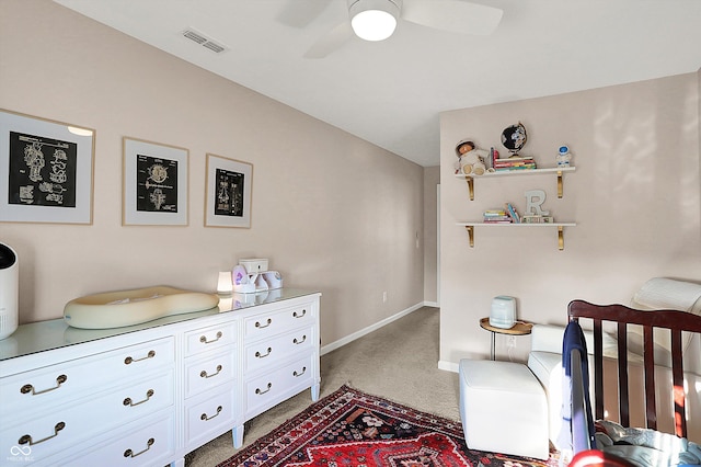 carpeted bedroom featuring visible vents, ceiling fan, and baseboards