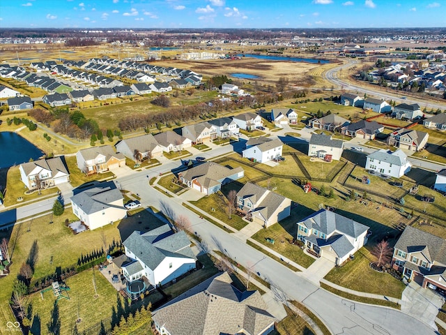 aerial view featuring a residential view and a water view