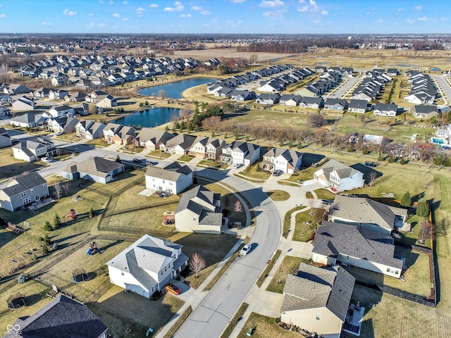 birds eye view of property with a residential view and a water view