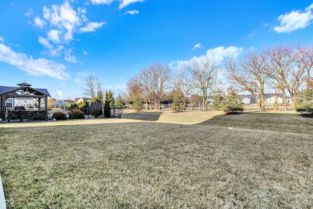 view of yard featuring a gazebo and fence