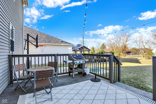 exterior space with a grill and a deck