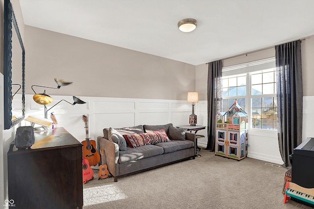 living room with carpet flooring and wainscoting