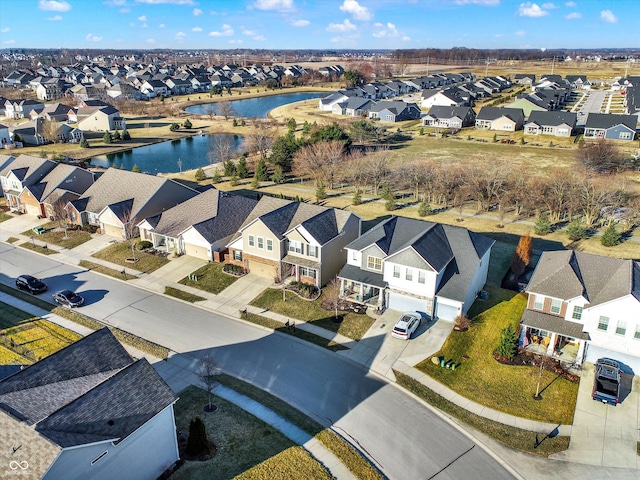 birds eye view of property with a residential view and a water view