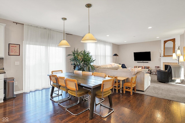 dining room with recessed lighting and dark wood-style floors