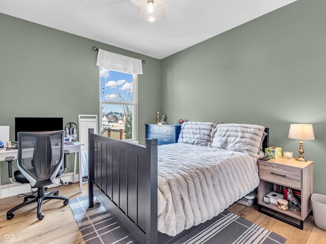 bedroom with wood finished floors